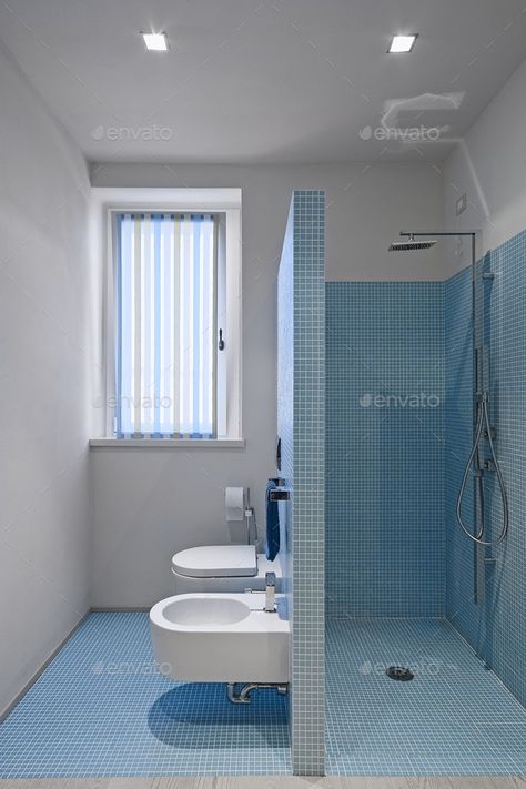 interiors shots of a modern bathroom with walls and floor coated of blue mosaic tile , in the foreground the masonry shower cubicle, the bidet and the toilet bowl House Bathroom Designs, Toilet And Bathroom Design, Bilik Air, Bathroom Design Layout, Washroom Design, Bad Inspiration, Bathroom Design Decor, Image Bank, Toilet Design