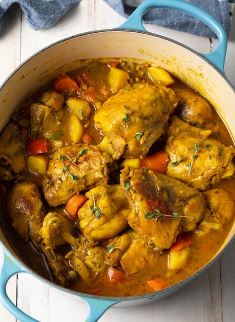 Jamaican Curry Chicken - A classic Caribbean yellow curry recipe made with chicken, potatoes, carrots, and lots of vibrant seasonings. This spicy, saucy dish is perfect to serve with rice and your favorite sides! #jamaicanrecipes #yellowchickencurry #caribbeanrecipes #spicychickencurry Caribbean Curry Chicken, Chicken Potatoes Carrots, Yellow Curry Chicken, Chicken And Potato Curry, Curry Chicken Thighs, Yellow Curry Recipe, Jamaican Chicken, Jamaican Curry Chicken, Jamaican Curry