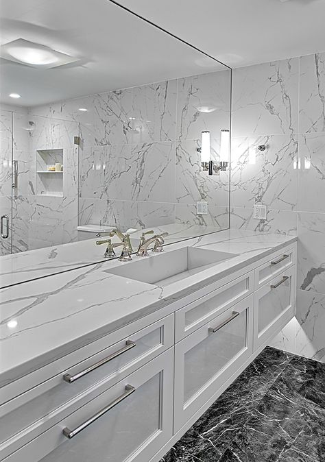 Floating white vanity has Quartz countertop with integrated sink and under lighting. Winnetka, IL bathroom remodel. #whitebathrooms #whitevanity #integratedsink #whitecabinets #custombathroom #modernbathroomvanity #whitecountertop #floatingvanity White Quartz Bathroom, Bathroom Counter Decor, Modern Luxury Bathroom, Relaxing Bathroom, Modern White Bathroom, Floating Bathroom Vanities, Bathroom Vanity Designs, Double Sinks, Large Bathroom