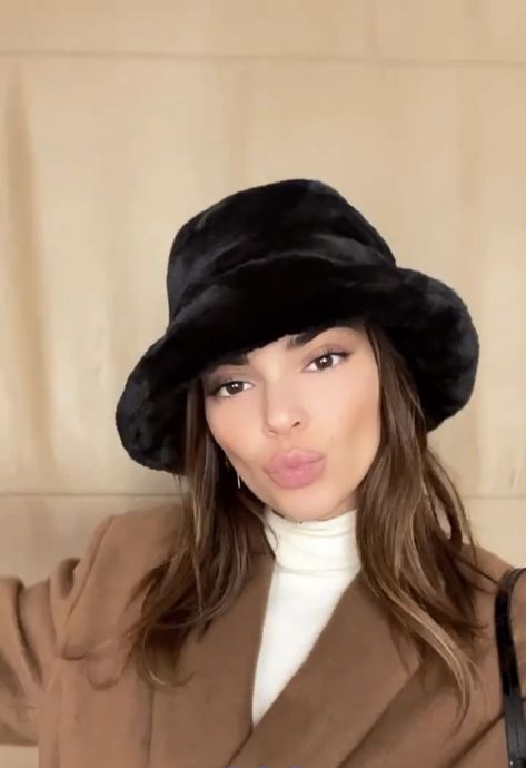 kendall jenner in black fuzzy bucket hat Faux Bucket Hat Outfit, Black Fuzzy Bucket Hat Outfit, Black Fur Bucket Hat, Puffy Hat Outfit, Kendall Jenner Bucket Hat, Black Fur Bucket Hat Outfit, Fuzzy Bucket Hat Outfit Winter, Black Bucket Hat Outfit Winter, House Of Sunny Cardigan Outfit