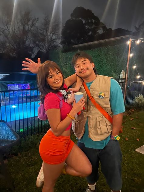 100+ Popular #HalloweenCostumes that are setting trends this year - Hike n Dip Halloween Dora The Explorer, Dora And Boots Costume Women, Dora And Diego Couple Costume, Dora Diego Costume, Dora And Swiper Costume, Dora The Explorer Costume Women, Dora And Diego Costume Halloween, Dora The Explorer Halloween Costume, Dora Costume College