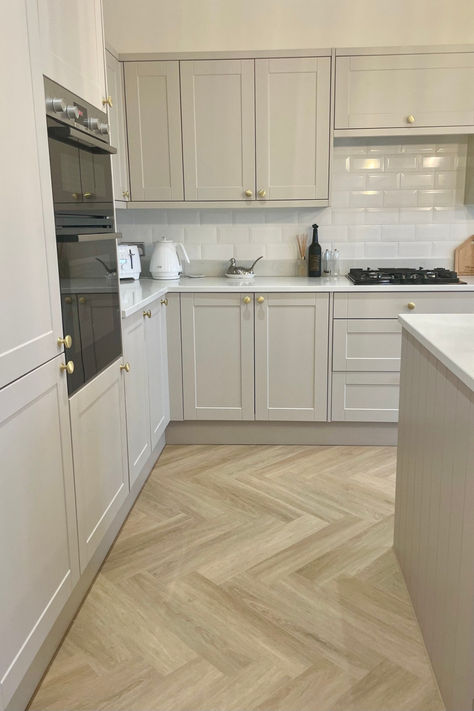 Happy couple standing in modern open plan kitchen 1930s House Renovation Kitchen, Terrace House Kitchen Ideas, Herringbone Floor In Kitchen, Kitchen Flooring Ideas Herringbone, Herringbone Floor Lounge, Kitchen And Hallway Flooring, Kitchen Ideas Herringbone Floor, Kitchen Diner Flooring Ideas, 1930s House Kitchen