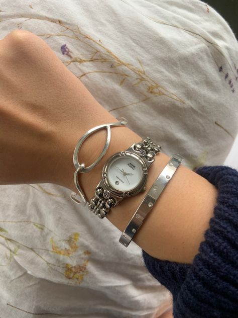 Silver Watch Bracelet Stack, Silver Jewerly Girl Aesthetic, Silver Watch And Bracelet Stack, Silver Jewellery Watch, Silver Bracelet Stack With Watch, Silver Jewellery Stacking, Silver Wrist Stack, Dainty Silver Watches For Women, Silver Vintage Watches Women