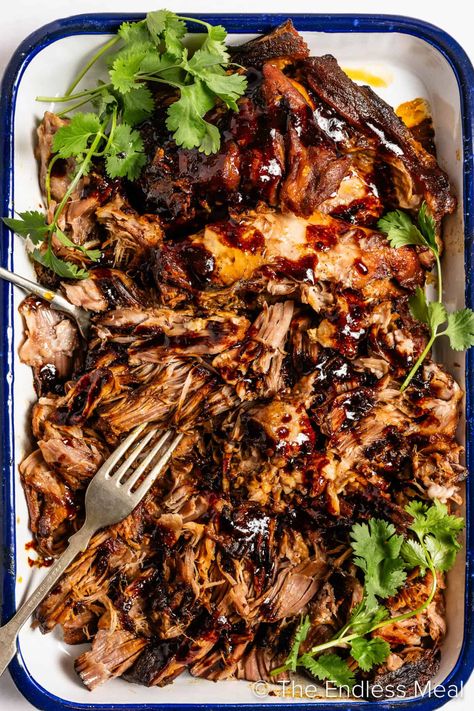 Win over the whole family with this flavor-packed Korean pulled pork. The meat slowly cooks away for hours, soaking up ALL the flavor from a delicious marinade of Korean gochujang, soy sauce, honey, and chicken stock. The best part: it's super easy thanks to the slow cooker. This succulent, melt-in-your-mouth masterpiece practically cooks itself! #theendlessmeal #pulledpork #crockpot #slowcooker #gochujang #korean #koreanpork #crockpotpork #porkrecipes #crockpotrecipes #koreanpulledpork #pork Asian Pork Crockpot Recipes, Korean Pulled Pork Slow Cooker, Korean Bbq Pulled Pork, Korean Pulled Pork, Pulled Pork Dip, Pork Dip, Korean Bbq Pork, Koreansk Mad, The Best Pulled Pork