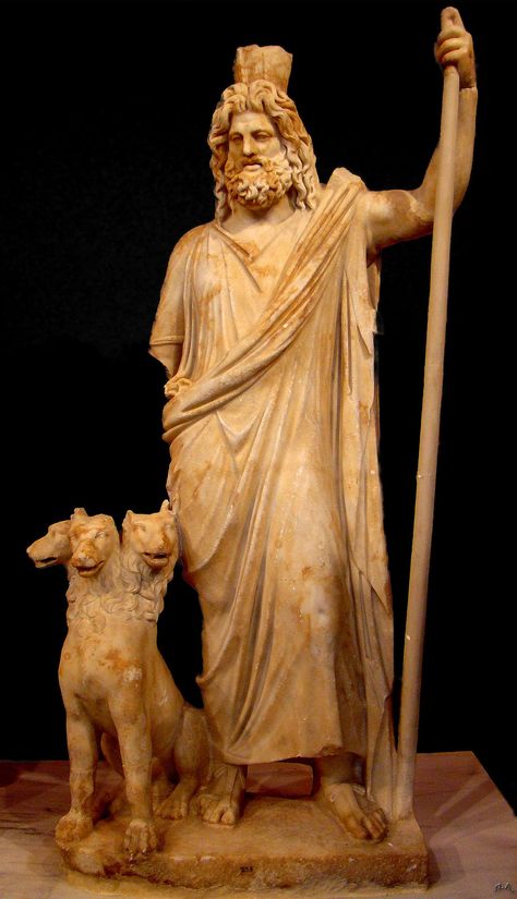 An ancient statue of Hades alongside Cerberus, the hound and guard of the Underworld gates The Underworld, Underworld, Statue, Dogs