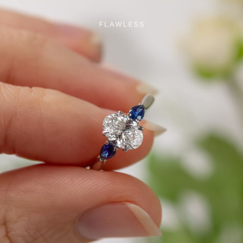 The possibilities are endless. 💍💙
We're loving this version of the Vivian with some gorgeous blue sapphire side stones to compliment the oval-cut centre diamond.

#engagementrings #sapphirering #bluesapphire #whitegoldring #engagementideas #engaged #diamondring #gemstonering Diamond Ring With Sapphire Accents, Diamond With Sapphire Side Stones, Sapphire Accent Engagement Ring, Sapphire Side Stones, Trilogy Engagement Ring, Sapphire Band, Side Stone Engagement Ring, White Gold Engagement Ring, Round Diamond Engagement Rings