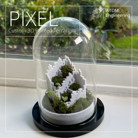 Introducing *PIXEL*    ---  A 3D printable and custom-designed terrarium insert.     Simply print the model then add the organic material of your choice, resulting in whatever theme you're trying to achieve, anywhere from a desert terrarium using sand and cacti to a mossy jungle-themed terrarium.     Printed using Marble Duramic 3D PLA+ 1.75mm filament.    [Purchase Marble Filament Here](https://www.amazon.com/dp/B083J7CYKM?maas=maas_adg_C8B6750C116658BC92D4909898A87D1A_afap_abs&ref_=aa_maas&ref=myi_titl Desert Terrarium, Glass Dome Display, Basic Geometry, Garden Bathroom, Moss Terrarium, Organic Decor, Engineering Projects, Arduino Projects, Mechanical Design