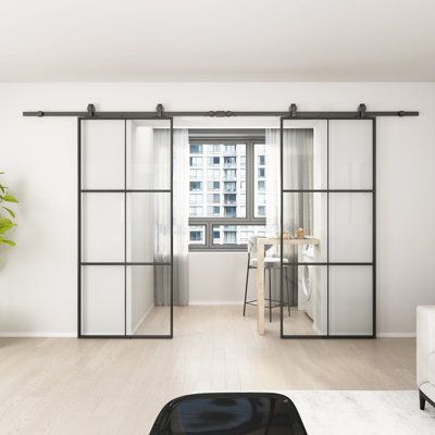 Just double barn doors come with clear tempered glass for extra strength and safety. Each door is paired with our classic roller hardware kit in a matte black finish. Combining both modern style and practicality, our barn doors offer a fresh and unique take on a traditional and timeless look. Ideal for openings up to 68 in. wide and up to 82 in. H. Our double barn door comes with (2) 79-1/5 in. Tracks, (2) 36 in. x 84 in. Doors and (1) track joiner. Assembly required. | Barn Door - JUBEST 72" x Double Pocket Doors, Sliding Glass Barn Doors, Glass Barn Door, Bypass Barn Door, House Planning, Glass Barn Doors, Metal Barn, Double Barn Doors, Office Inspo