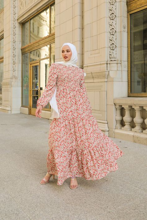 Spectacular, utterly fashionable, and insanely comfortable are perfect ways to describe Niswa’s new Haya Floral Maxi Gown. This stunning printed floral dress hints at spring. The floor-length dress features smocked bodice detailing, a gorgeous twirl-worthy skirt, cinched balloon sleeves, and a high rounded neckline. - Care: Dry Clean Recommended. Hand Wash/Hang Dry. - Composition: Polyester Blend - Lined - Not Transparent - Fit: Standard FitModel wearing size S Dress Measurements: SIZE BUST WAIS Maxi Dress Hijab Outfits, Floral Maxi Dress Outfit Summer, Dress Floral Hijab, Maxi Dress With Hijab, Casual Hijab Dress, Floral Dress Modest, Ensemble Hijab, Maxi Dress Hijab, Shoes For Prom