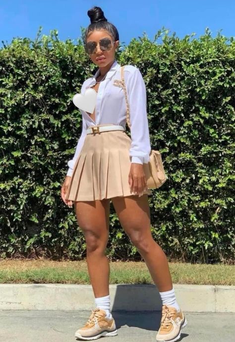 Mini Skirt Outfit With Sneakers, Shein Brunch Outfit Ideas Black Women, Brown Pleated Mini Skirt Outfit, Girly Outfits With Sneakers, Tan Skirt Outfit Black Women, Skater Skirt Outfit Black Women, How To Style Plaid Skirt Outfit, Skort Outfit Baddie, Birthday Brunch Outfit Ideas