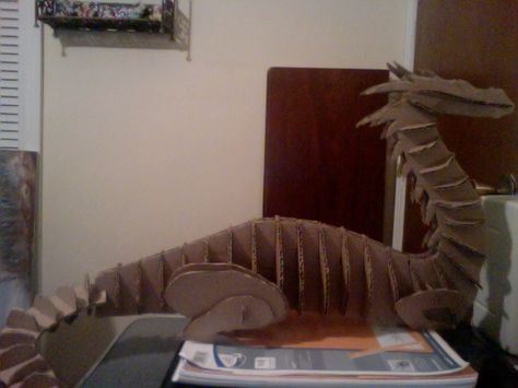 For an art project at college we had to create an animal made out of cardboard...and mine was a DRAGON! It stands about 1ft. tall, 2ft. long, and the largest it gets in width is about 6in. Cardboard Dragon Head, Cardboard Dragon, Paper Castle, Create An Animal, Make A Dragon, Paper Masks, Cardboard Cartons, Sculpting Tutorials, Castle Decor