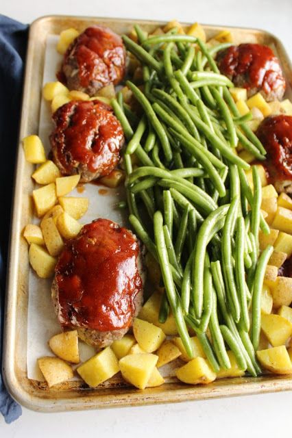 Make your whole homestyle meal on one sheet pan. Everyone can enjoy their own mini meatloaf along with roasted green beans and potatoes and there's only one pan to clean! Sheet Pan Meatloaf And Green Beans, Sheet Pan Meatloaf Recipes, Sheet Pan Meatballs And Veggies, Sheet Pan Mini Meatloaf, Fast Supper Ideas With Ground Beef, Ground Beef Potatoes Green Beans, Sheet Pan Mini Meatloaves, Mini Meatloaf Sheet Pan Dinner, One Pan Hamburger Meals