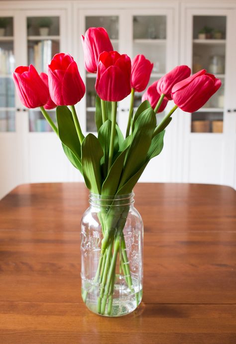 DIY Faux Tulip Arrangement from MichaelsMakers White House Black Shutters Faux Tulips In Vase, Faux Tulip Arrangement, Flowers Arrangements For Home, White House Black Shutters, Faux Tulips, Tulip Arrangement, Tulips Arrangement, Black Shutters, Faux Flower Arrangements