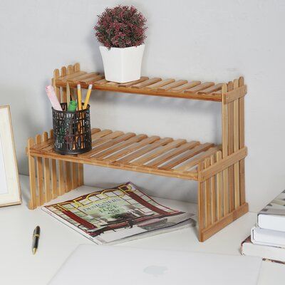 Display your favourite small potted plants or other miscellaneous decorations on this stylish rack. The slatted design is ideal for sunny weather and will bring a warm atmosphere. It can be used for multiple purposes throughout the family. This display stand features bamboo wood slat shelves making it perfect for displaying outdoor patio items such as plants and gnomes, but it can also serve as a sweet indoor display stand as well. The material is sturdy and durable and will add special charm to Organize Mugs, Shadow Box Shelves, Bamboo Flower, Desktop Bookshelf, Desktop Shelf, Slatted Shelves, Stand Shelf, Bamboo Shelf, Bamboo Construction