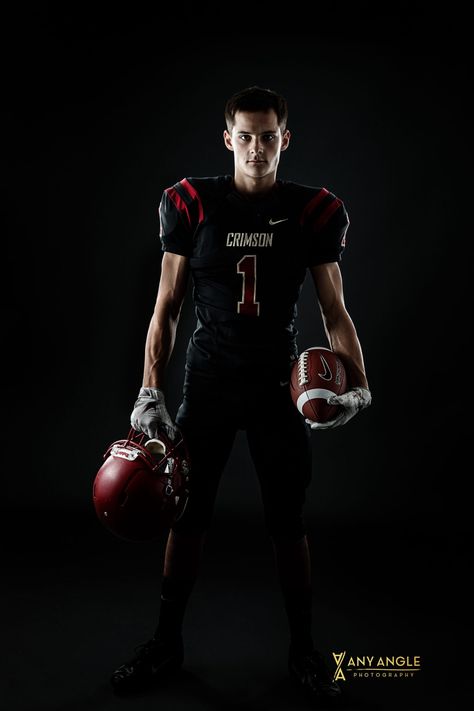 Senior pictures of a guy in his football uniform with football in a studio with dark background. #seniorpictures #footballplayer #seniorguy #studio #anyanglephotography #minnesota #footballposes Senior Football Photography, Youth Sports Photography, Football Senior Photos, Football Players Pictures, Football Senior Pictures, Composite Images, Angle Photography, Cheer Photography, Football Poses