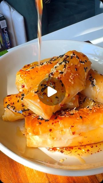 Easy Home Meals on Instagram: "These Baked Feta Parcels with Warm Honey are perfectly sweet and salty! Wrapped in golden, crispy Phyllo Dough and slathered with high-quality butter, these parcels deliver the perfect crunch. 

For the full recipe, visit the link in our bio!

Made by cookingwithlamees using @athens_foods and @landolakesktchn

#AD #RealFoodFrozen #DairyAndBeyond #feta #bakedfeta" Feta Parcels, Easy Home Meals, Phyllo Dough Recipes, Athens Food, Baked Feta, Home Meals, Phyllo Dough, Sweet And Salty, Real Food Recipes