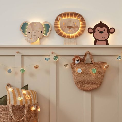 Transform your child's room into a real adventure with our set of safari themed children's lights! 1 x lion wall light; 1 x elephant wall light; 1 x monkey wall light; 1 x 12 LED wooden safari fairy lights; 1 x 12 LED acrylic safari fairy lights; remote controlDimensions: Lion (H) 35 x (W) 36.5cm; Elephant (H) 25.6 x (W) 35cm; Monkey (H) 25.5 x (W) 35cmDimensions of fairy lights: The fairy lights are each 1.65m long with a 0.5m lead to the battery compartmentTotal of 12 x AA and 3 x AAA batteries (sold separately); Wall lights and fairy lights including 6 hour timer functionExclusive to Lights4funThis beautiful ensemble includes a lion wall light, an elephant wall light, a monkey wall light, wooden safari fairy lights and acrylic safari fairy lights.This set will undoubtedly add magical li Safari Toddler Room, Lion Bedroom, Safari Bedroom, Lion Decor, Childrens Night Light, Monkey Wall, Childrens Bedroom Decor, Outdoor Fairy Lights, Cheeky Monkey