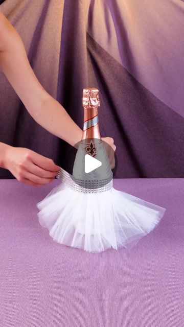 5-Minute Crafts on Instagram: "Prepare your champagne bottle for the big day 🎊  #5minutecrafts #weddingday #weddingparty #weddingdecor #bottledecor" Wine Bottle Bride And Groom, Bride And Groom Bottles, Bottle Wine Decoration, Decorated Wine Bottles For Wedding, Wine Bottle Centerpieces For Wedding Diy, Wine Bottles Crafts, Decorative Bottles Ideas, Champagne Decorations Bottle, Wine Bottle Bouquet Diy