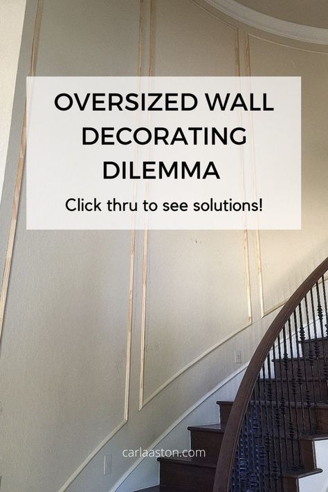 Oversized, awkward wall spaces can look especially bare if not treated somehow. Use trim moulding to help break up the big wall space and then you don’t HAVE to buy a bunch of big art pieces or lay out a complicated gallery wall. See more examples by linking through. carlaaston.com Wallpaper Staircase Wall, Large Stairway Wall Decor, Stair Wall Decorating Ideas, Big Art Pieces, Stair Accent Wall, Stairwell Wall Ideas, Stairway Wall Decor, Stairwell Accent Wall, Stair Wall Decor