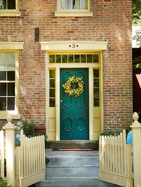 A fresh coat of paint or wreath adds personality to this front entry. More front entry lighting and accessories: http://www.bhg.com/home-improvement/door/exterior/front-door-lighting-and-accessories/?socsrc=bhgpin072513wreath=3 Green Front Door, Teal Front Doors, Teal Door, Front Door Lighting, Traditional Front Doors, Green Front Doors, Brick Siding, Door Colors, Front Entryway