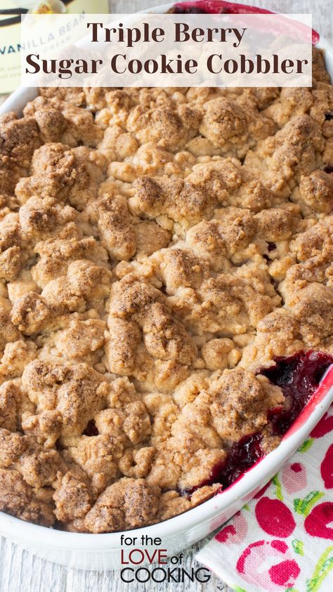 This triple berry sugar cookie cobbler is a deliciously sweet mixed berry cobbler with a buttery sugar cookie topping.   New Recipe ~ Triple Berry Sugar Cookie Cobbler   Link: https://fortheloveofcooking.net/recipe/triple-berry-sugar-cookie-cobbler  #recipes #cobbler #blackberries #raspberry #strawberry #dessert #fruitdessert #berries #berrydelicious Crumbl Triple Berry Cobbler Cookie, Cookie Crumble Recipe, Cookie Cobbler, Triple Berry Crisp, Triple Berry Cobbler, Mixed Berry Dessert, Raspberry Cobbler, Mixed Berry Cobbler, Triple Berry Pie