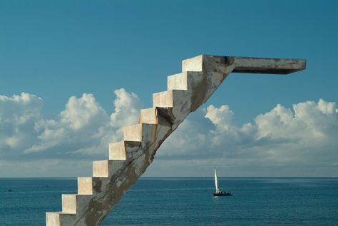 Southern Africa. Mozambique. Ilha de Mocambique. Stone town. Dhows passing abandoned concrete staircase and diving board from abandoned Portuguese swimming pool. Ilha De Mocambique, Mozambique, Southern East Africa. Olympic Diving, Diving Springboard, Double Indemnity, Diving Boards, Concrete Staircase, Sea Diving, Deep Sea Diving, Stone Town, Diving Board