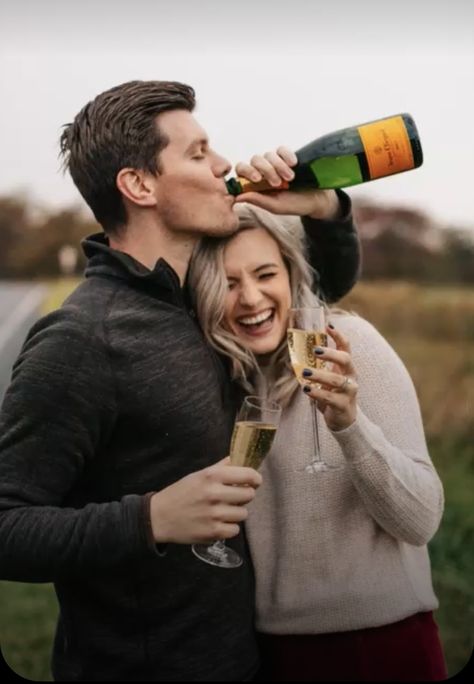 Fun Couple Engagement Photos, Christmas Wedding Ring Photos, Engagement Photos On Iphone, Realistic Engagement Photos, Engagement Champagne Bottle Photos, Engagement Photoshoot Ideas With Champagne, Engagement Photo Poses Champagne, Creative Engagement Shoot Ideas, Engagement Photos Funny Creative