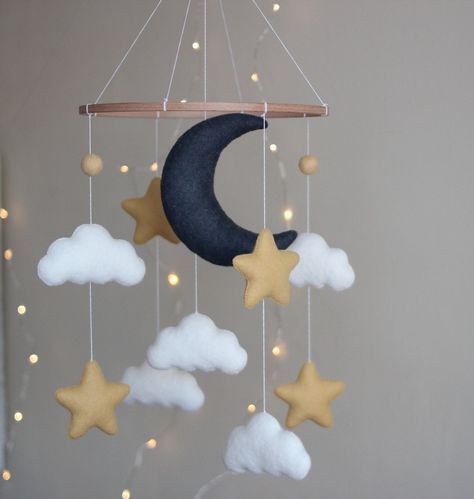 Hanging felt mobile with moon ,  stars and clouds . Best present for your new child or for a baby shower.The parts could be changed and a completely new one can be added. All toys are specially designed and handmade for bringing color and tenderness to the Baby's Room. Made with eco-friendly polyester felt and wool blend felt of the highest quality.Individual design is possible.  You can request your preferred palette color if item doesn't match your nursery. Just ask me if you want to change an Moon Crib, Star Themed Nursery, Crib Decoration, Stars Baby Mobile, Diy Baby Mobile, Mobile Crib, Moon Nursery, Star Mobile, Mobile Nursery