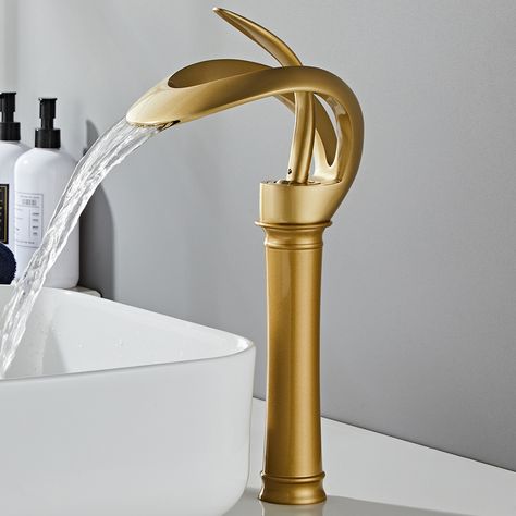 Create a modern class with the gold waterfall bathroom faucet. Its wide spout is complemented by contemporary lever handles, sure to add elegance to any bathroom. Built from lead-free solid brass composition, this faucet is a durable and attractive piece to renew your bathroom with contemporary appeal. Designed with a single handle, it is a breeze to adjust the water flow and temperature precisely.- Constructed from solid brass for durability and reliability.- Finished in high quality, corrosion Black And Brass Bathroom, Bathroom Sink Faucets Waterfall, Gold Bad, Black Bathroom Sink, Brass Bathroom Faucets, Bathroom Faucets Waterfall, Waterfall Bathroom, Vessel Sink Faucet, Waterfall Faucet