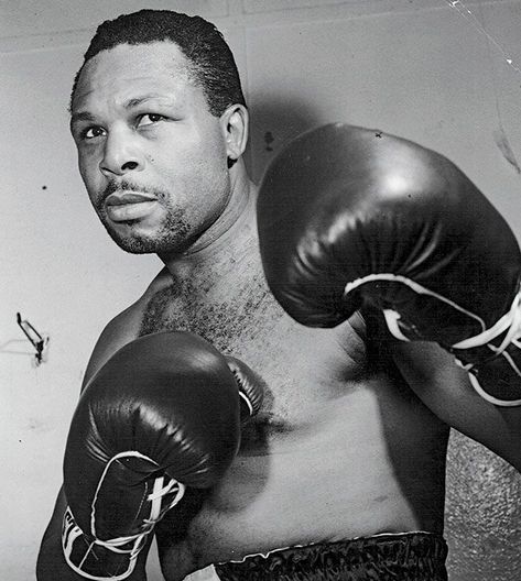 The one and only “Old Mongoose”, Archie Moore. His record of 185-23-10 (131) boasts the most knockouts by any single fighter in boxing history, and made his debut in 1935 before his eventual retirement, 28 years later, in 1963. In his final 30 fights – when he was closing in on his 50th year – the only man he didn’t beat was a young Cassius Clay (before he changed his name to Muhammad Ali). Moore was already well past his best, he drew future world light-heavyweight champion Willie Pastrano Archie Moore Boxer, Jaromir Funke, Archie Moore, Boxing Legends, Cassius Clay, Boxing Images, Joe Louis, Boxing History, Volunteer Firefighter