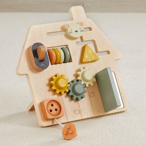 Keep baby busy on the go with our compact wood On-the Go Busy Board! 6 super fun activities to help junior develop small motor skills and color recognition. They will be delighted by the sounds and tactile stimulation. Activities include maze, abacus, peek-a-boo door with a surprise mirror inside, gears, switch and 3 prong plug. Perfect for travel, baby can play on planes, in trains and automobiles. Can be played flat on the floor or table, or stand it up to play. Busy, busy, busy! Materials Ply Boo Door, Stimulation Activities, Boo's Door, Maileg Dolls, Busy Boards, Tactile Stimulation, Travel Baby, Busy Busy, Handmade Wooden Toys