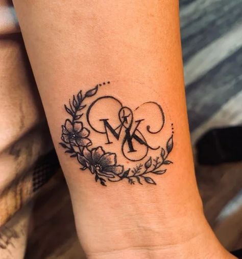 105+ Initial Tattoo Ideas To Commemorate Your Loved Ones C And L Initial Tattoo, M Name Tattoo Designs, Couple Tattoos Stencil, Tattoo Ideas For Spouse Name, Monogram Tattoo Ideas, Old English Letters Tattoo Design, Boyfriends Name Tattoo Ideas Design, Boyfriends Initials Tattoo, Floral Initial Tattoo