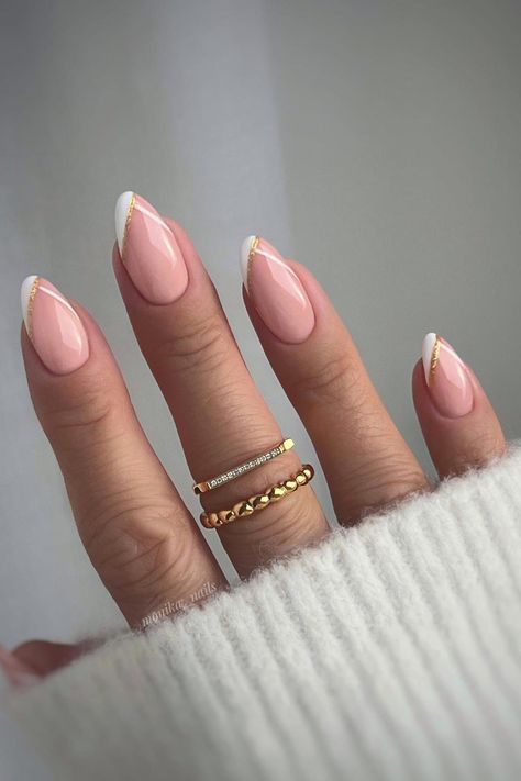 Timeless Glamour: Almond-shaped nails in delicate pale pink embrace sophistication, harmonized with a diagonal white French tip adorned with a touch of gold foil, radiating subtle luxury. // Photo Credit: Instagram @monika__nails Paznokcie Hello Kitty, Almond Gel Nails, Sophisticated Nails, Natural Nails Manicure, Chic Manicure, Kutek Disney, French Manicure Designs, Natural Nail Designs, Manikur Kuku