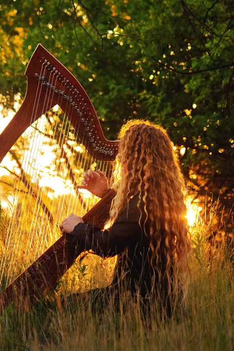 Harpist at sunset, II | I will always come back to this set … | Flickr Loreena Mckennitt, Celtic Harp, Viking Metal, Celtic Music, Celtic Woman, Power Metal, Wild Woman, Long Curly Hair, The Grass