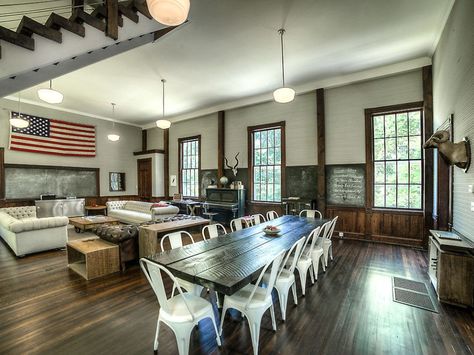 Choosing an 1893 one-room schoolhouse as the place to start an inn doesn't seem like the most practical choice, unless you're not expecting many guests, but that's exactly what the owners of this home did. After a year of renovations beginning in 2012, Hillside Schoolhouse, which was also a gospel church in the 1950s but had been empty since 2000, became a boutique inn. It now has two bedroom suites, but all of the original historical details including original windows, floors and slate... Old School House, Communal Table, Wood Staircase, Country Style Kitchen, School House, Old House Dreams, Farmhouse Sink, Bedroom Suite, Kitchen Styling