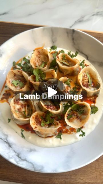 Kausar Raja on Instagram: "Spicy Lamb Dumplings Recipe 🥟

These are somewhere between Nepalese Momo’s and Turkish Manti - authentic to neither cuisine but inspired by both.  A beautiful combination!! 

For the filling: 
- 500g lean lamb mince
- 4 spring onions, finely chopped
- 30g coriander, finely chopped
- 4 garlic cloves
- 1 inch size ginger
- 2 tbsp light soy sauce
- 2 tbsp sesame oil
- 1 tsp ground coriander
- 1 tsp ground cumin
- 1/2 or 1 tsp red chilli powder (depending on your spice tolerance level)
- 1 tsp msg 

For the dough:
- 250g all purpose flour (plain)
- 150ml warm water
- Pinch of salt

This recipe makes approx 35-40 small dumplings, 25-30 bigger ones. I usually freeze most of them (before cooking) for another day! 

#dumplings #homemadedumplings #dumpling #mantı #momos Lamb Dumplings, Business Bakery, Homemade Dumplings, Red Chilli Powder, Dumplings Recipe, Spring Onions, Dumpling Recipe, All Purpose Flour, Red Chilli