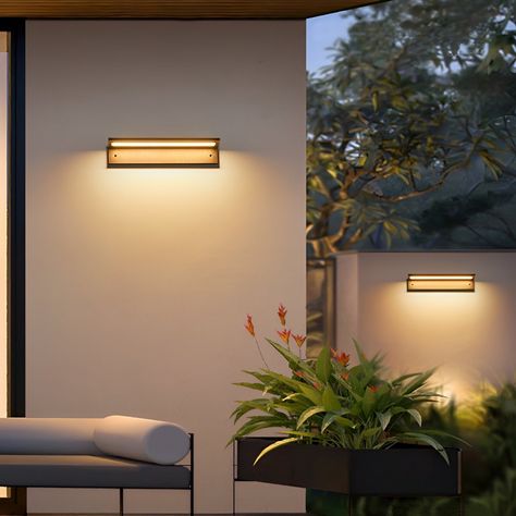 Illuminate your entryway in style with the Rectangle Waterproof Modern Minimalist Outdoor Wall Porch Lights Wall Sconce Front Door Plate Exterior Light.   Sleek, rectangular acrylic and aluminum design  Long-lasting, energy-efficient LED bulb  Warm 3000K color temperature for a cozy glow  IP54 waterproof rating for all-weather use  Illuminates up to 108 sq ft with 9-12W power   Elevate your home's curb appeal with this modern, minimalist wall sconce. The clean, rectangular silhouette and black finish create a striking visual statement, while the high-quality LED bulb provides long-lasting, energy-efficient illumination. Boasting an IP54 waterproof rating, this light can withstand the elements year-round, making it the perfect choice for enhancing your porch, fence, or outdoor living spaces Mid Century Outdoor Lighting, Porch Fence, Mid Century Outdoor, Outdoor Columns, Column Lighting, Mid Century Exterior, Porch Lights, Door Plate, Exterior Light Fixtures