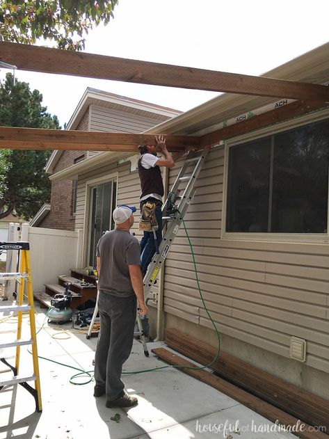 Building a pergola attached to the house. How to attach cross beams to the header. Housefulofhandmade.com How To Attach A Pergola To A House, How To Anchor Pergola To Concrete, How To Attach, Building A Pergola Attached To House, How To Build A Pergola, Patio Awning Attached To House, Build An Awning, Plant Landscaping Ideas, Outdoor Patio Roof Ideas