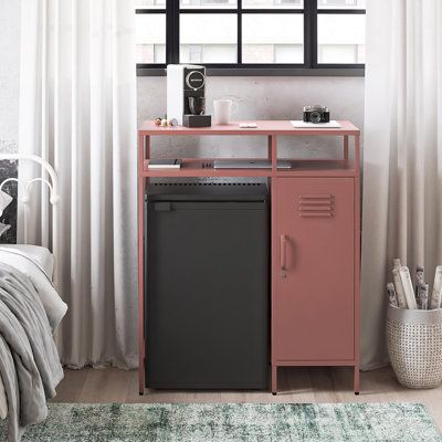 Keep your space chic and organized, no matter how cozy, with the Cache Metal Locker-Style Mini Refrigerator Organizer- a must-have for dorm dwellers, home office hustlers, and city slickers alike. Say goodbye to wasted nooks and crannies and hello to a sleek, upscale vibe in your abode. This compact wonder packs a punch with its clever mix of open and closed storage, perfect for tidying up your essentials or flaunting your faves. Plus, the top shelf serves up some serious horizontal real estate Office Mini Fridge Station, Small Office Coffee Station Mini Fridge, Mini Fridge Cabinet Office, Desk Mini Fridge, College Dorm Appliances, Hidden Mini Fridge Cabinet, Gifts For First Apartment, Bedroom Mini Fridge Ideas, Single Dorm Decor