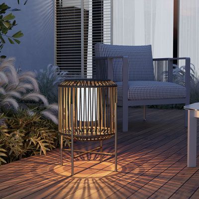 All-weather Design: Featuring an IP44 waterproof rating and a weighted base, this solar lamp is resistant to rain, snow, and other harsh weather conditions, making it a reliable option for your outdoor lighting needs. | Grand Patio 22" Solar Powered Integrated LED Outdoor Floor Lamp in Brown / Gray | 22 H x 16 W x 16 D in | Wayfair Wicker Floor Lamp, Outdoor Floor Lamp, Solar Hanging Lanterns, Outdoor Table Tops, Outdoor Floor Lamps, Outdoor Table Lamps, Solar Lamp, Deck Garden, Patio Lighting