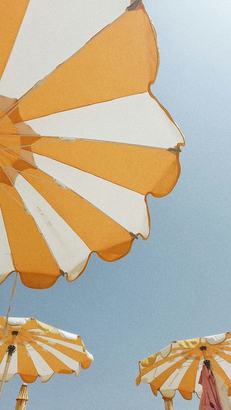 A bright and cheerful summer scene in Sanremo, Italy, featuring a row of yellow and white striped umbrellas set against a brilliant blue sky. The umbrellas, positioned along the sandy beach, create a vibrant and inviting atmosphere, perfect for a day of relaxation by the Mediterranean Sea. The contrasting colors of the yellow and white umbrellas against the deep blue sky emphasize the sunny, warm weather typical of summer in Sanremo. This image encapsulates the joyful and leisurely spirit of a summer day in this beautiful Italian coastal town, where the seaside and the sun play a central role in the local lifestyle. Vintage Beach Aesthetic, Italian Festival, Sanremo Italy, Italian Vibes, Italian Beach, Mediterranean Vibes, Clear Beaches, Italian Beaches, Italy Beaches