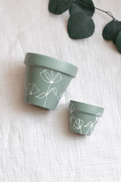 Beautiful sage carefully hand painted with love - perfect for your plant’s new home #handpainted #terracotta #indoorplantsdecor Diy Paint Planter Pot, Simple Plant Pot Painting, Mini Plant Pot Painting, Teracota Pot Painting Ideas, Simple Painted Pots, Plant Pot Designs Paint, Plant Pot Painting Ideas Boho, Paint Pots Ideas, Painting Planters Pots Ideas