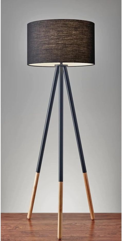 With a classic tripod stance, the Louise floor lamp offers plenty of design versatility. The black painted metal legs and fabric drum shade easily suit contemporary and modern spaces, while the eco-friendly rubber wood leg tips soften the look for urban, casual, or updated lodge looks. Black Metal Floor Lamp, Black Tripod Floor Lamp, Lodge Look, Unique Table Lamps, Tripod Floor Lamp, Wood Floor Lamp, Floor Standing Lamps, Metal Floor, Metal Floor Lamps