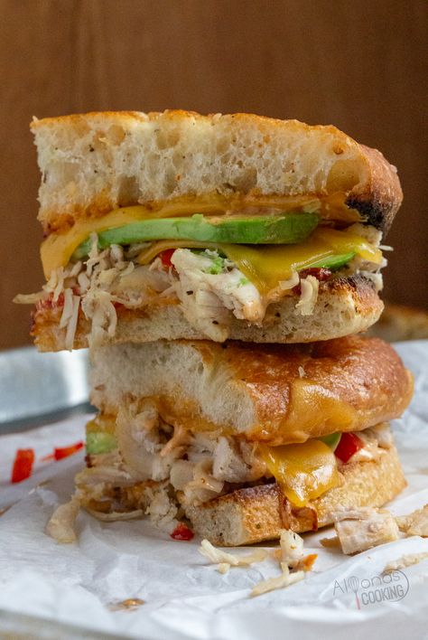 A chipotle chicken panini is a toasted sandwich made with Foccacia bread, avocado, cheese, cherry peppers, and chipotle sauce! It is the chipotle chicken panini, Panera Bread makes and I'm sharing all the tips for making this panini sandwich at home! #chicken #sandwich #Bread #Recipe Panera Chipotle Chicken Avocado Melt, Chipotle Chicken Panini, Panera Sandwiches, Chicken Avocado Melt, Chicken Panini Sandwiches, Cherry Peppers, Toasted Sandwich, Chicken Panini, Foccacia Bread