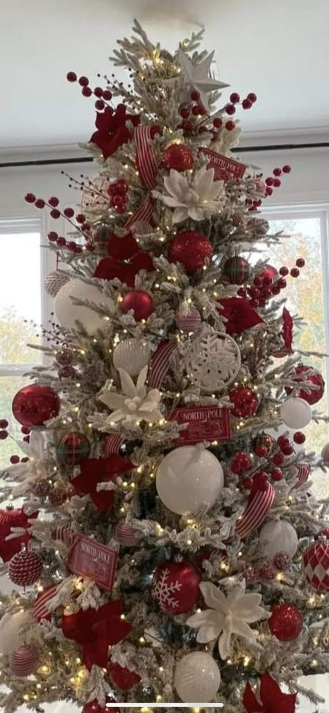 Santa Clause Themed Tree, Red Glam Christmas Tree, Christmas Tree Ideas Flowers, Red Decor Christmas Tree, Snowflake Christmas Tree Theme, Christmas Tree With Poinsettia Flowers, Cardinal Christmas Tree Ideas, Red And Champagne Christmas Tree, Frosted Christmas Tree Ideas