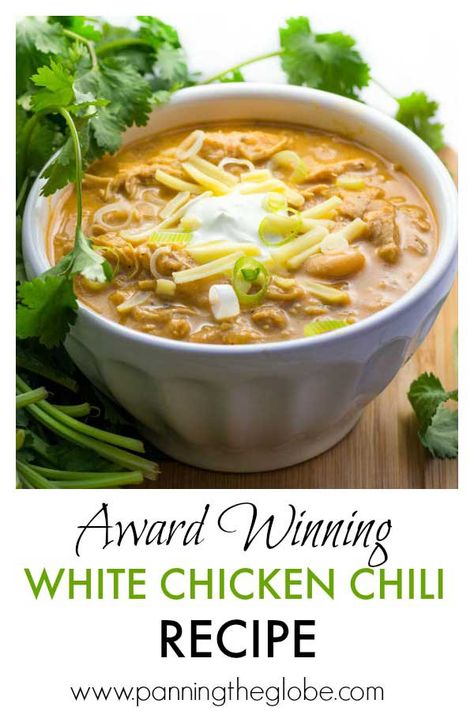 It's easy to cook a big pot of this award winning white chicken chili, and it's the absolute BEST! Tender chicken, chilies, white beans, spices and a few more goodies in this winning white chicken chili recipe! Top with sour cream, cheese, scallions, a drizzle of your favorite hot sauce. It's makes a lot of chili, but it freezes really well! #chicken #chili #recipe #ChickenChili Award Winning White Chicken Chili Recipe, Award Winning White Chicken Chili, White Chicken Chili Slow Cooker, White Chicken Chili Recipe, Chili Chili, White Chili Chicken Recipe, White Chili, Chicken Chili Recipe, White Chicken Chili