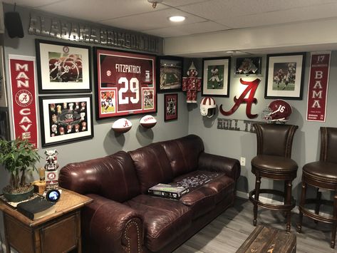 Sport Mancave Ideas, Man Cave Media Room Ideas, College Football Basement, Basement Game Room Wall Decor, Sports Theme Living Room, Alabama Man Cave Ideas, Sports Theme Family Room, Sports Living Room Decor, Sports Room Man Cave Football