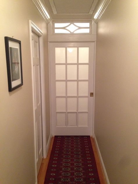 Frosted glass pocket door and transom bisects long hallway and adds privacy to master bedroom suite. Hallway Privacy Door, Bedroom Door With Glass Panels, End Of Hallway Closet Door Ideas, Pocket Door Hallway, Add Door To Hallway, Door To Close Off Hallway, Door At End Of Hallway, Door For Hallway, Dining Room Conversion