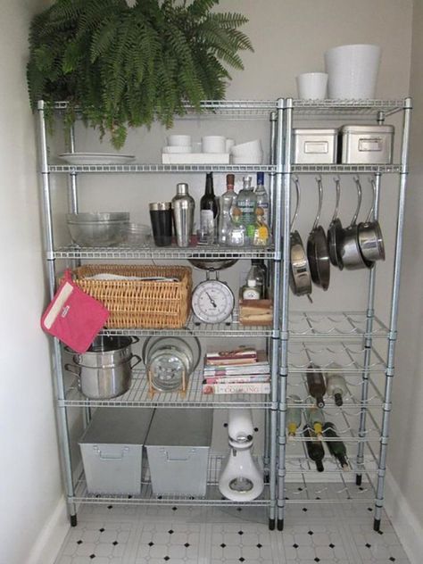 5 Easy Ways To Make Space In Your Tiny Kitchen | MAKE MOST FREQUENTLY USED ITEMS EASILY ACCESSIBLE | Wire rack with kitchen supply and fern against white wall. Studio Apartment Storage, Organized Pantry, Apartment Storage, Kabinet Dapur, Small Kitchen Organization, Small Kitchen Storage, Maximize Storage, Apartment Decoration, Apartment Organization