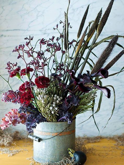 For an organic look straight out of nature, be a little eclectic in your fall display and arrangements. Gather a variety of flowers, stems, fillers, and twigs and arrange at random. Use a rustic or vintage-looking vessel, such as a galvanized bucket, to complete the look. Autumn Display, Fall Arrangements, Flower Bucket, Nature Inspired Decor, Flowers Arrangements, Trendy Flowers, Fabulous Fall, Flowers Garden, Floral Display